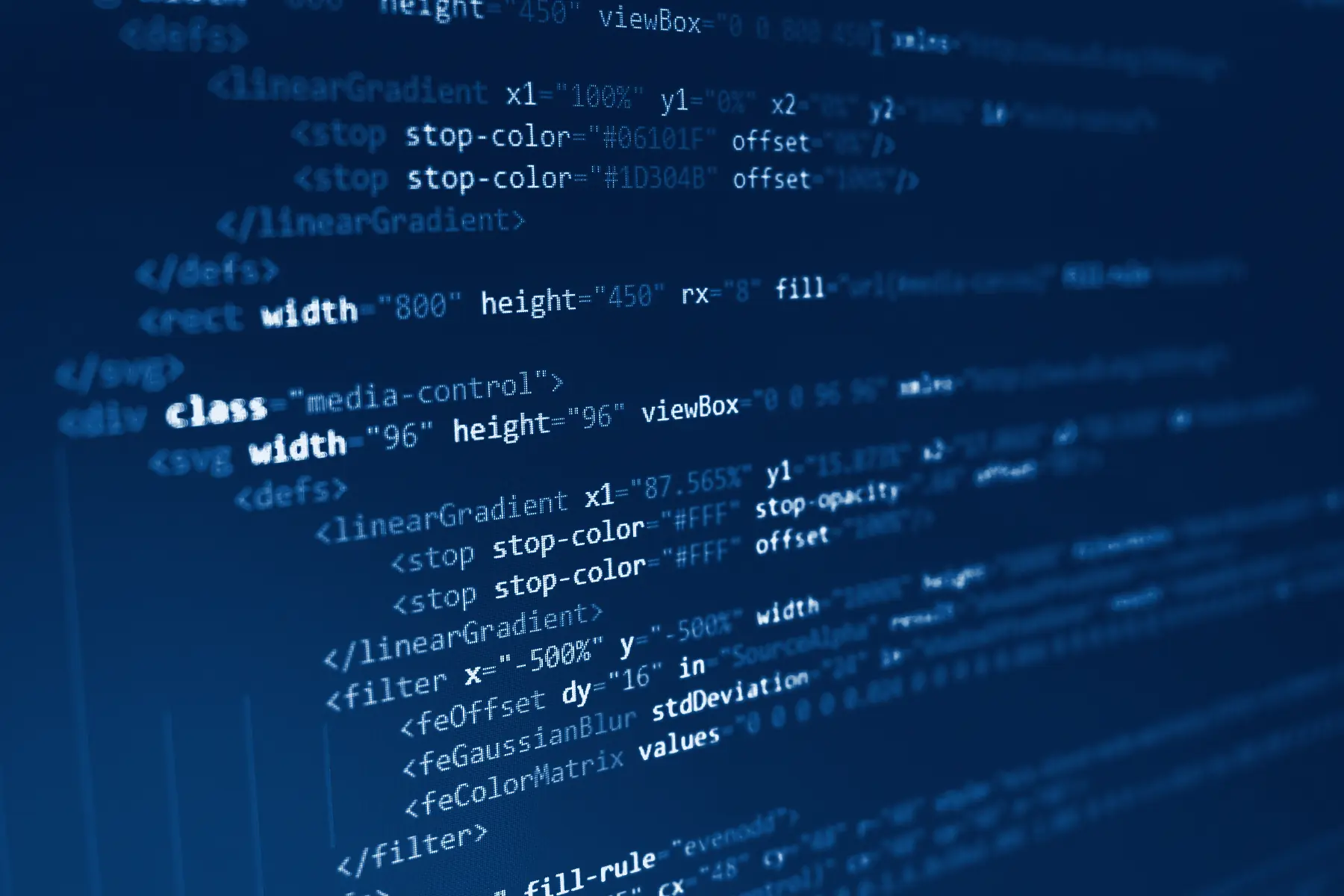 Lines of code on a monitor, in Capdeva navy