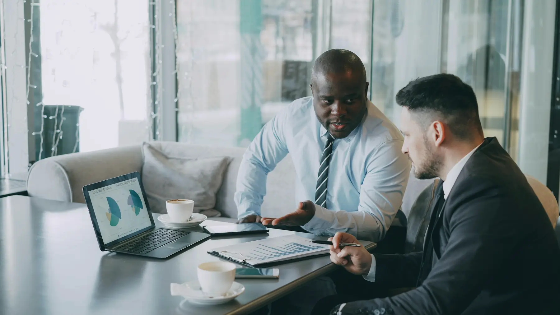 An advisor going through documents with a client at a table
